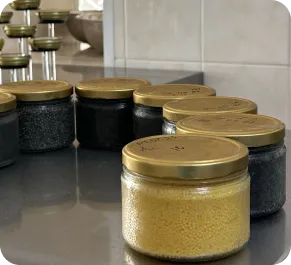 Jars of black and golden caviar